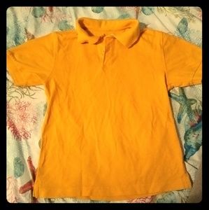 Gold boy's uniform shirt.